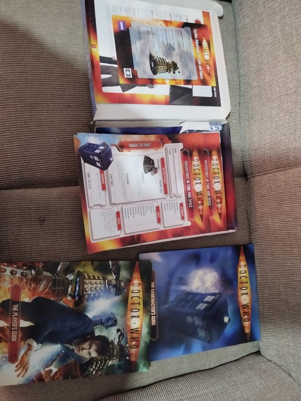 doctor who rpg box inside theres books and tokens